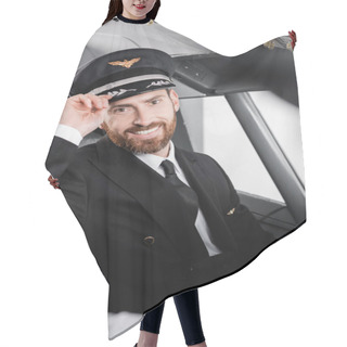 Personality  Bearded Pilot In Uniform Adjusting Cap And Smiling Near Blurred Co-pilot  Hair Cutting Cape