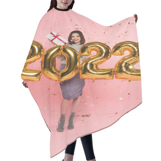 Personality  Smiling Woman Holding Present Near Balloons In Shape Of 2022 And Confetti On Pink Background Hair Cutting Cape