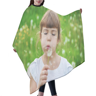 Personality  Girl Blowing Dandelions In The Air. Selective Focus. Hair Cutting Cape