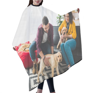 Personality  Couple Playing With Two Labrador Puppies While Sitting On Sofa Hair Cutting Cape