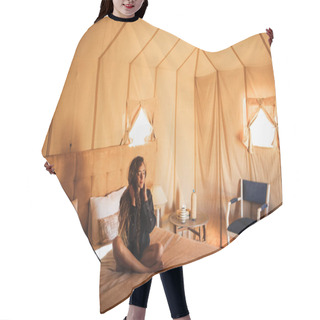 Personality  Sensual Glamour Portrait Of Oriental Woman In Interior Of Modern Luxury Glamping Tent Camp In Morocco. Relaxing On Bed. Eco Design Concept, Natural And Wooden Elements In Style. Hair Cutting Cape