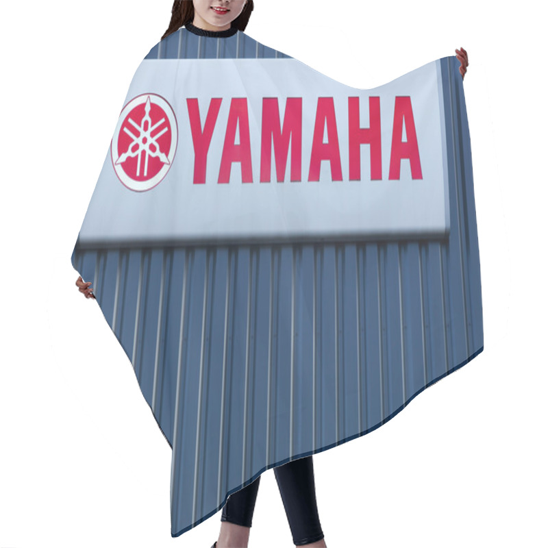 Personality  Yamaha Logo On A Wall Of A Dealer Hair Cutting Cape