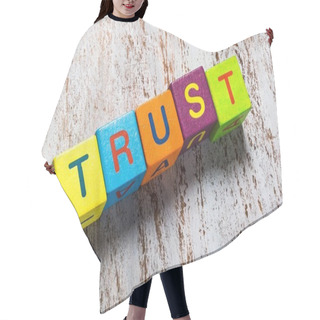 Personality  Trust. Concept Of Trust Word On Wooden Cubes Hair Cutting Cape