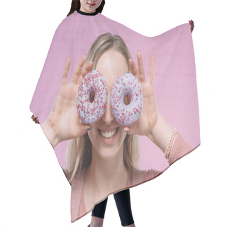 Personality  Smiling Young Woman Covering Eyes With Doughnuts In Front Of Pink Brick Wall Hair Cutting Cape