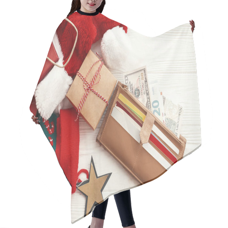 Personality  Christmas  shopping and sales concept. Credit cards and money in wallet, paper bags with clothes, stockings, gift boxes, jewelry on white rustic background. Seasonal advertising and sale hair cutting cape