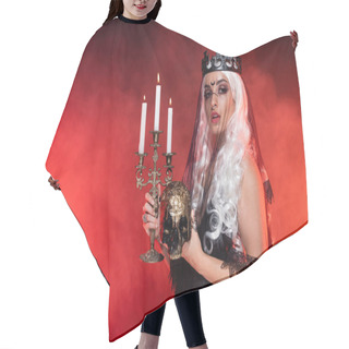 Personality  Blonde Woman In Witch Costume Holding Golden Skull And Burning Candles On Dark Background With Smoke Hair Cutting Cape