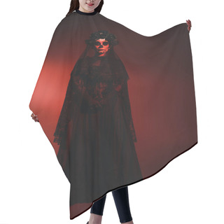 Personality  Full Length Of Woman In Mexican Santa Muerte Costume Looking At Camera On Burgundy Background With Red Lighting  Hair Cutting Cape