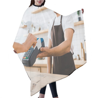 Personality  Cropped View Of Cashier Standing Near Bar Counter And Holding Terminal Wile Woman Paying With Credit Card In Coffee House Hair Cutting Cape