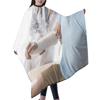 Personality  Cropped View Of Orthopedist Putting Bandage On Injured Hand Of Man  Hair Cutting Cape