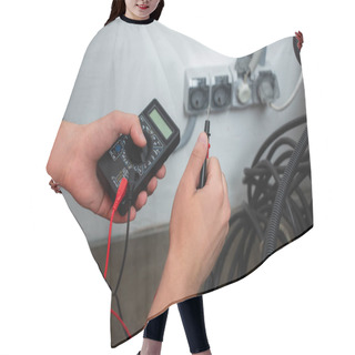 Personality  Cropped View Of Workman Holding Electrical Tester  Hair Cutting Cape