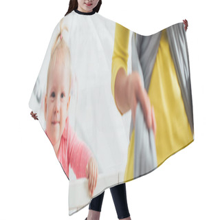 Personality  Panoramic Shot Of Infant In Crib Near Mother Wearing Baby Sling  Hair Cutting Cape