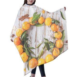 Personality  Clementines Tangerines With Leaves As Christmas Wreath With Cinnamon Sticks And Anise Over White Wooden Plank Background. Top View, Space. New Year Cards And Decorations. Square Images Hair Cutting Cape