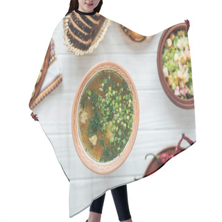 Personality  Selective Focus Of Traditional Fish Soup With Green Onion And Dishes Around On White Wooden Background Hair Cutting Cape