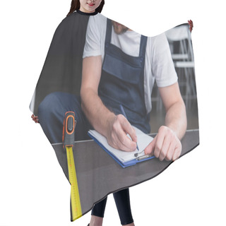 Personality  Cropped Image Of Male Handyman Making Measurements And Writing In Clipboard Hair Cutting Cape
