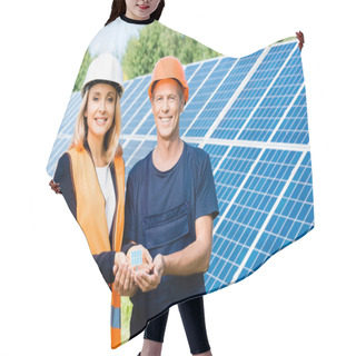 Personality  Handsome Engineer And Businesswoman Smiling And Holding Solar Energy Battery Model  Hair Cutting Cape