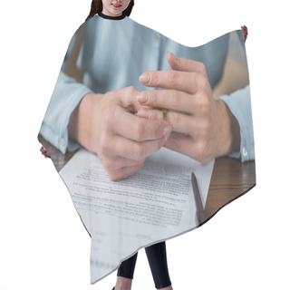 Personality  Cropped Shot Of Woman Taking Off Wedding Ring And Divorce Decree On Table Hair Cutting Cape