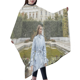 Personality  Young Woman In Blue Trench Coat Standing Near Fountain And Historical Building In Green Park In Vienna  Hair Cutting Cape