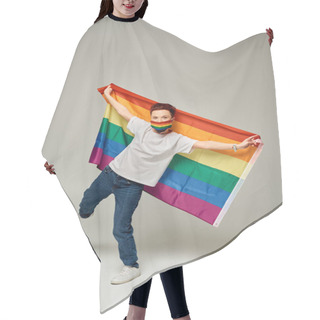 Personality  Full Length Of Redhead Queer Model In Rainbow Colors Medical Mask Holding LGBT Flag On Grey Hair Cutting Cape