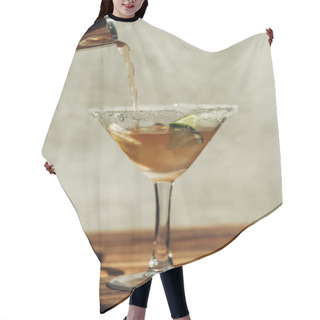 Personality  Liquid Pouring From Shaker Into Martini Glass With Ice, Lemon And Lime Decorated With Sugar On Wooden Surface In Sunlight Hair Cutting Cape