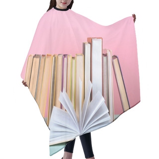 Personality  Open Book In Front Of Row Of Books On Table On Pink Hair Cutting Cape