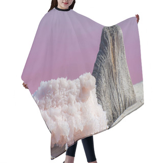 Personality  Big Salt Crystal On Wooden Pillar On A Pink Salty Lake. Healing Salt And Mud For Cosmetology. Hair Cutting Cape