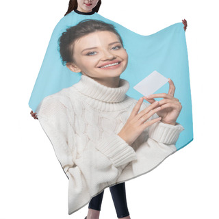 Personality  Cheerful Woman In White Knitted Sweater Holding Blank Card Isolated On Blue Hair Cutting Cape