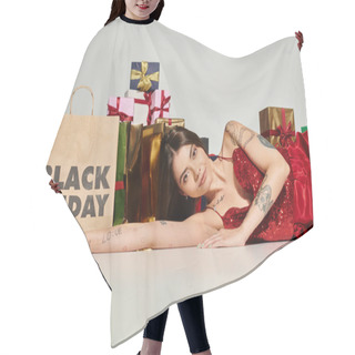 Personality  Alluring Young Woman Posing On Floor Near Presents And Shopping Bag On Ecru Backdrop, Black Friday Hair Cutting Cape