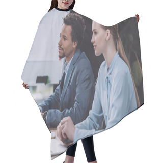 Personality  Attentive Businesswoman Sitting Near African American Colleague At Business Meeting Hair Cutting Cape
