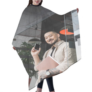 Personality  Happy Asian Businessman With Tattoo Holding Folder And Smartphone Near Glass Door Of Office Hair Cutting Cape