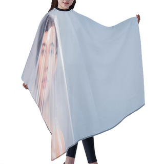 Personality  Panoramic Shot Of Model Covered With Polyethylene Looking At Camera Isolated On Grey, Ecology Concept Hair Cutting Cape