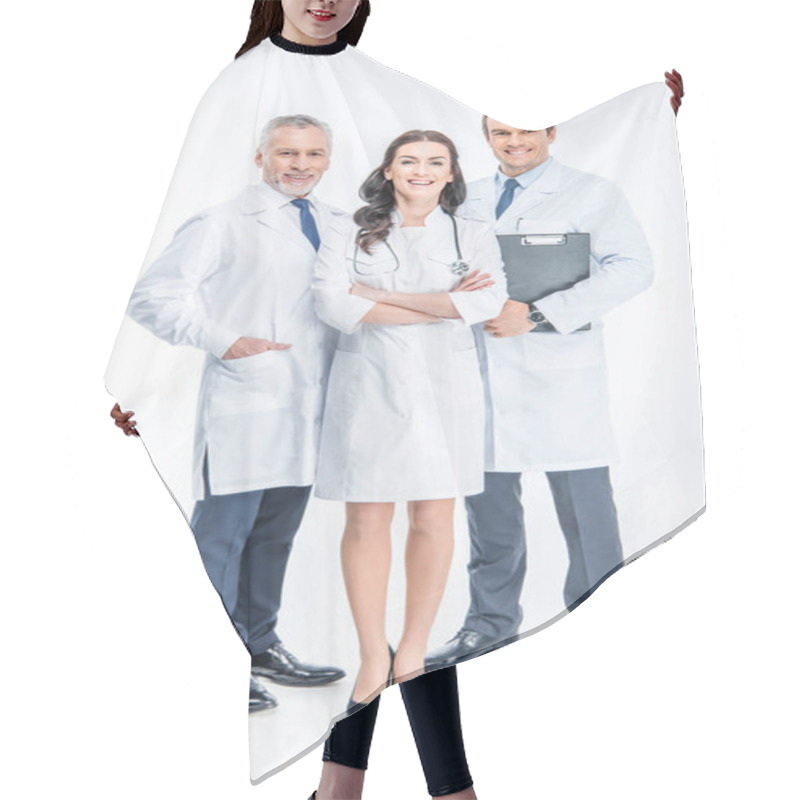 Personality  Three confident doctors hair cutting cape