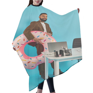 Personality  A Man Sits At A Desk, Staring At A Massive Donut In Front Of Him. The Donut Is Larger Than Life, Enticing And Surreal. Hair Cutting Cape