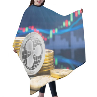 Personality  Ripple (XRP) And Cryptocurrency Investing Concept - Physical Metal Ripple Coins With Global Trading Exchange Market Price Chart In The Background. Hair Cutting Cape