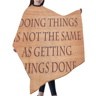 Personality  Doing Things Is Not The Same As Getting Things Done - Quote On Wooden Red Oak Background Hair Cutting Cape