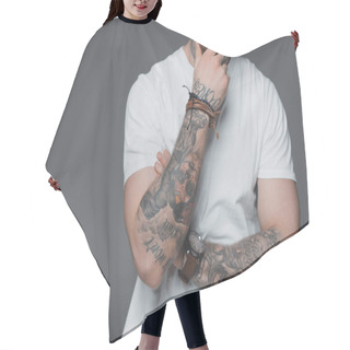 Personality  Cropped Shot Of Stylish Young Tattooed Man In White T-shirt Standing With Hand On Chin Isolated On Grey Hair Cutting Cape