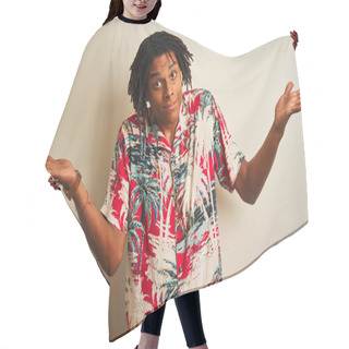 Personality  Afro Man With Dreadlocks On Vacation Wearing Summer Shirt Over Isolated White Background Clueless And Confused Expression With Arms And Hands Raised. Doubt Concept. Hair Cutting Cape