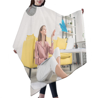 Personality  Happy Woman Sitting On Floor And Playing With Paper Plane At Home Hair Cutting Cape