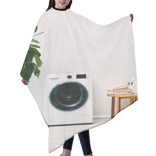 Personality  Green Plant Near Washing Machine And Wooden Coffee Table With Towels And Detergent Bottle In Bathroom  Hair Cutting Cape