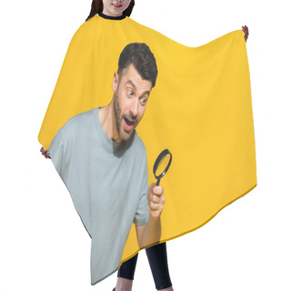 Personality  Photo Of Positive Stylish Man Hold Magnifying Glass Interested Look Empty Space Advert Sale Discount Isolated On Yellow Color Background. Hair Cutting Cape