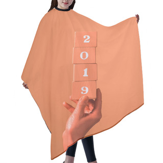 Personality  Partial View Of Woman Holding Coral Wooden Cubes With 2019 Numbers On Coral Background, Color Of 2019 Concept Hair Cutting Cape