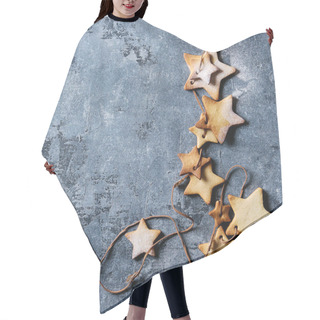 Personality  Homemade Shortbread Star Shape Sugar Cookies Different Size With Sugar Powder On Thread Over Blue Texture Surface. Christmas Treat Background. Top View With Space. Square Image Hair Cutting Cape