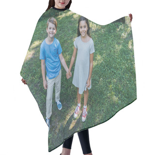 Personality  High Angle View Of Cute Children Holding Hands And Smiling At Camera In Park  Hair Cutting Cape