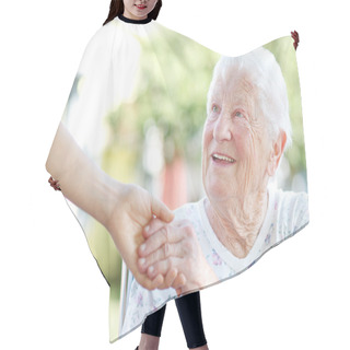 Personality  Senior Woman Holding Hands With Caretaker Hair Cutting Cape