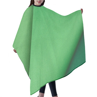 Personality  Top View Of Green Paper On Colored Background Hair Cutting Cape