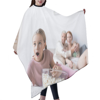 Personality  Shocked Child Watching Tv Near Popcorn And Blurred Mothers On Bed  Hair Cutting Cape