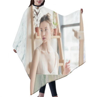 Personality  Beautiful Pensive Girl Holding Picture And Looking Away In Art Studio  Hair Cutting Cape