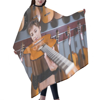 Personality  Young Customer Looking At Blurred Acoustic Guitar In Music Store Hair Cutting Cape