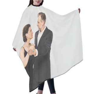 Personality  Ballroom Dance Middle Aged Couple In A Dance Pose And Smiling Isolated On Grey Background Hair Cutting Cape