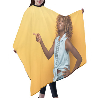 Personality  Happy African American Woman Pointing With Finger On Yellow Background Hair Cutting Cape