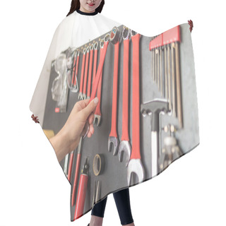 Personality  Man Hand Holding Wrench. Other Tools On The Wall. Hair Cutting Cape